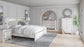 Altyra King Panel Bookcase Bed with Mirrored Dresser, Chest and Nightstand